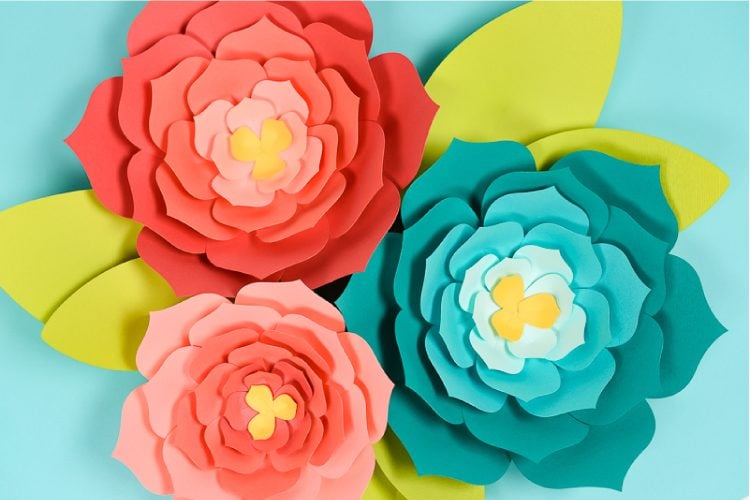 three large paper flowers cut using a Cricut